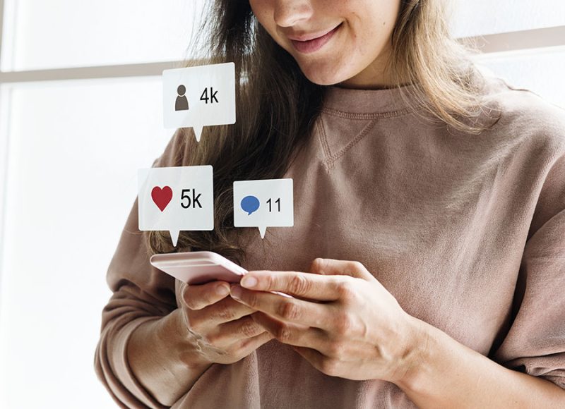Woman using a smartphone social media conecpt